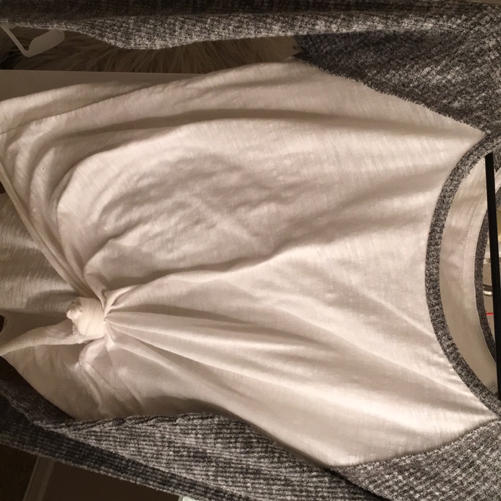 A round neck white long sleeve with grey sleeves.